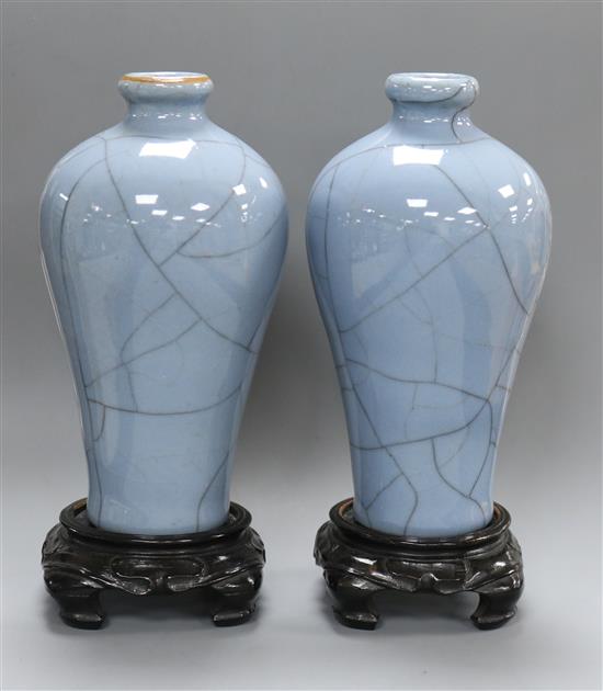 A pair of blue Chinese crackleware vases on stands